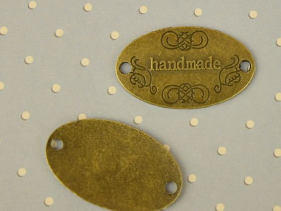 Бирка Hand Made металева Овал 31х18 мм колір антична бронза, розмір 25х6 мм