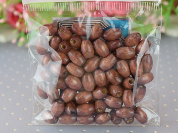 Набір дерев'яних намистин, зерно 10*6мм КОРИЧНЕВІ, 10 г Набір дерев'яних намистин, зерно 10*6мм КОРИЧНЕВІ, 10 г