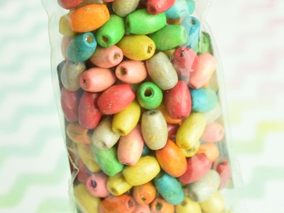 Бусинки деревянные , цветне,  размер 8*6 мм ассорти 10 гр