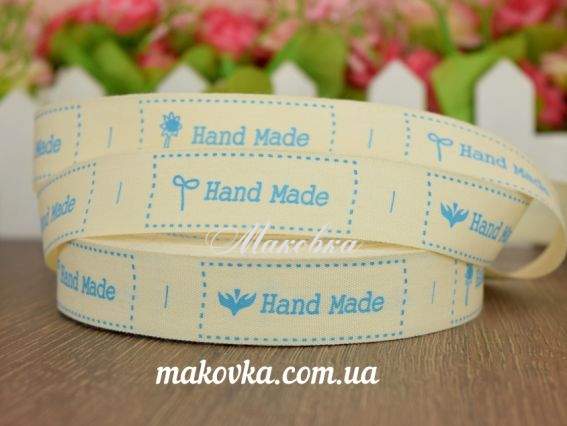Лента с бирками Handmade голубой шрифт с цветком, тканевая, 2 см, 1 метр Лента с бирками Handmade голубой шрифт с цветком, тканевая, 2 см, 1 метр