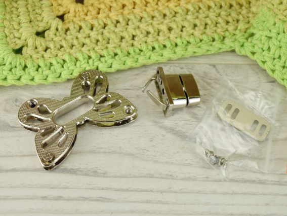 Сумочний замочок Твіст МЕТЕЛИК платина 50х35мм 1 шт