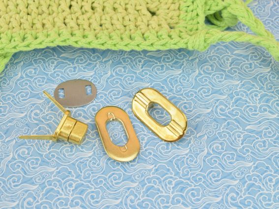 Сумочний замочок Твіст №4593 колір ЗОЛОТО  овальний поворотний (Твіст) 35х18мм 1 шт